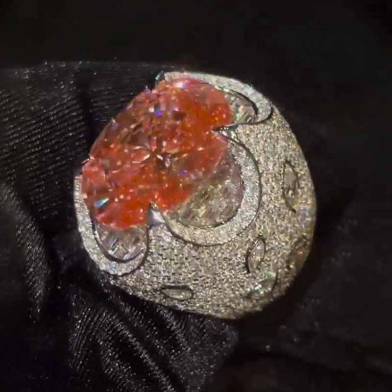 Kiss The Ring Of A Moissanite Oval Spessartine Ring