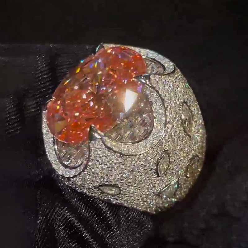 Kiss The Ring Of A Moissanite Oval Spessartine Ring