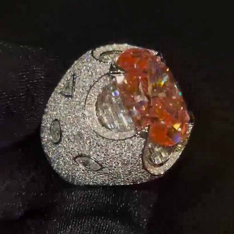 Kiss The Ring Of A Moissanite Oval Spessartine Ring